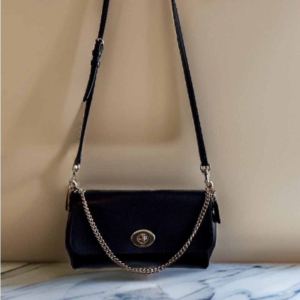 Black with gold hardware Coach crossbody.